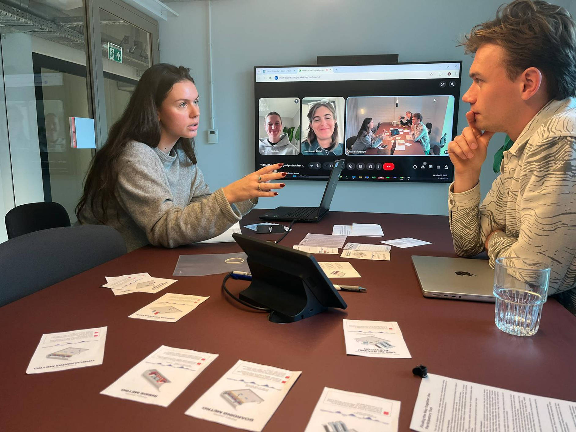 A woman and a men discussing in a meeting room